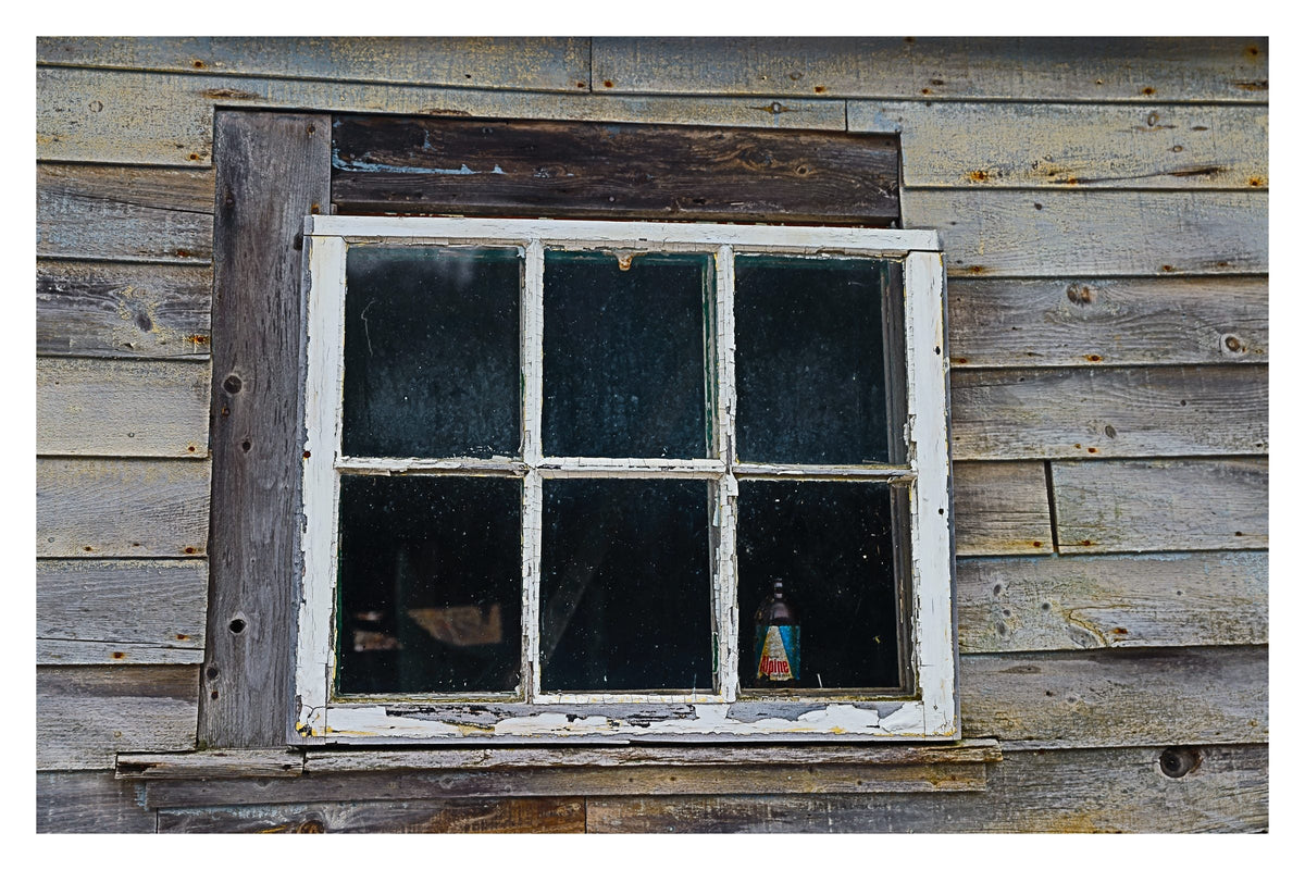 Boathouse and Beer, Gallery Edition print: an old beer bottle in the window of a weathered boathouse, New Brunswick